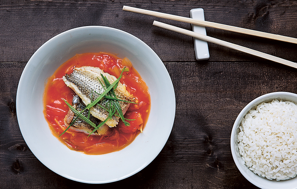 Taken from China: The Cookbook, sea bass with tomatoes has Hong Kong origins (Photo by by DL Acken)